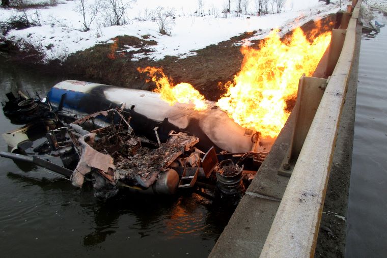 A propane tanker went off Vermont Route 14 early Monday morning and caught fire in the Black River.